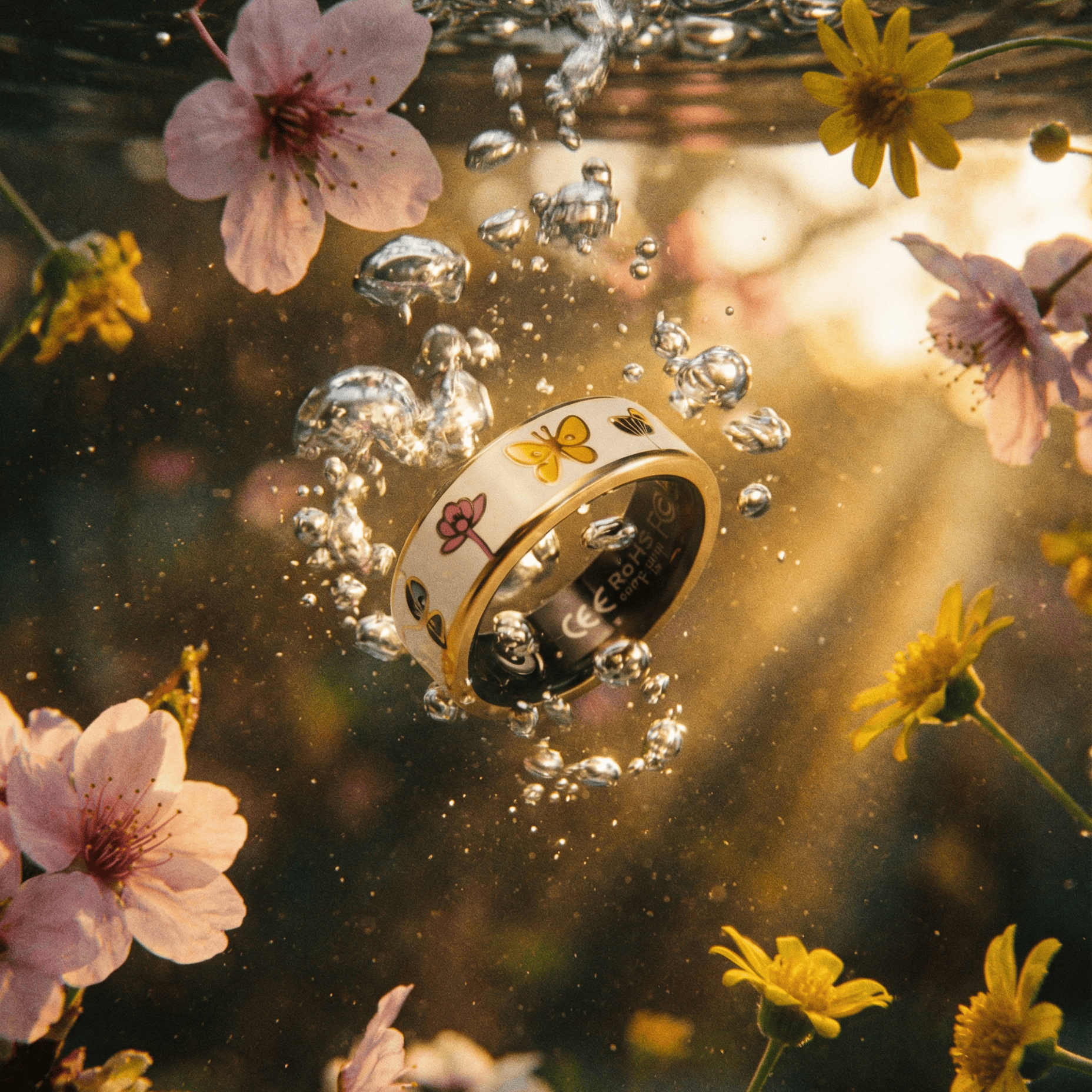 Smart Ring with floral design submerged in water surrounded by flowers