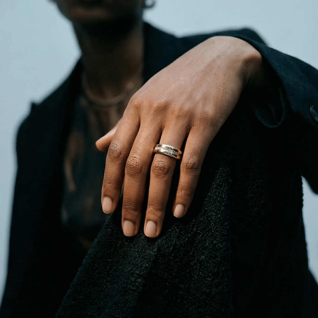 Hand with a fashion smart ring on a blurred background